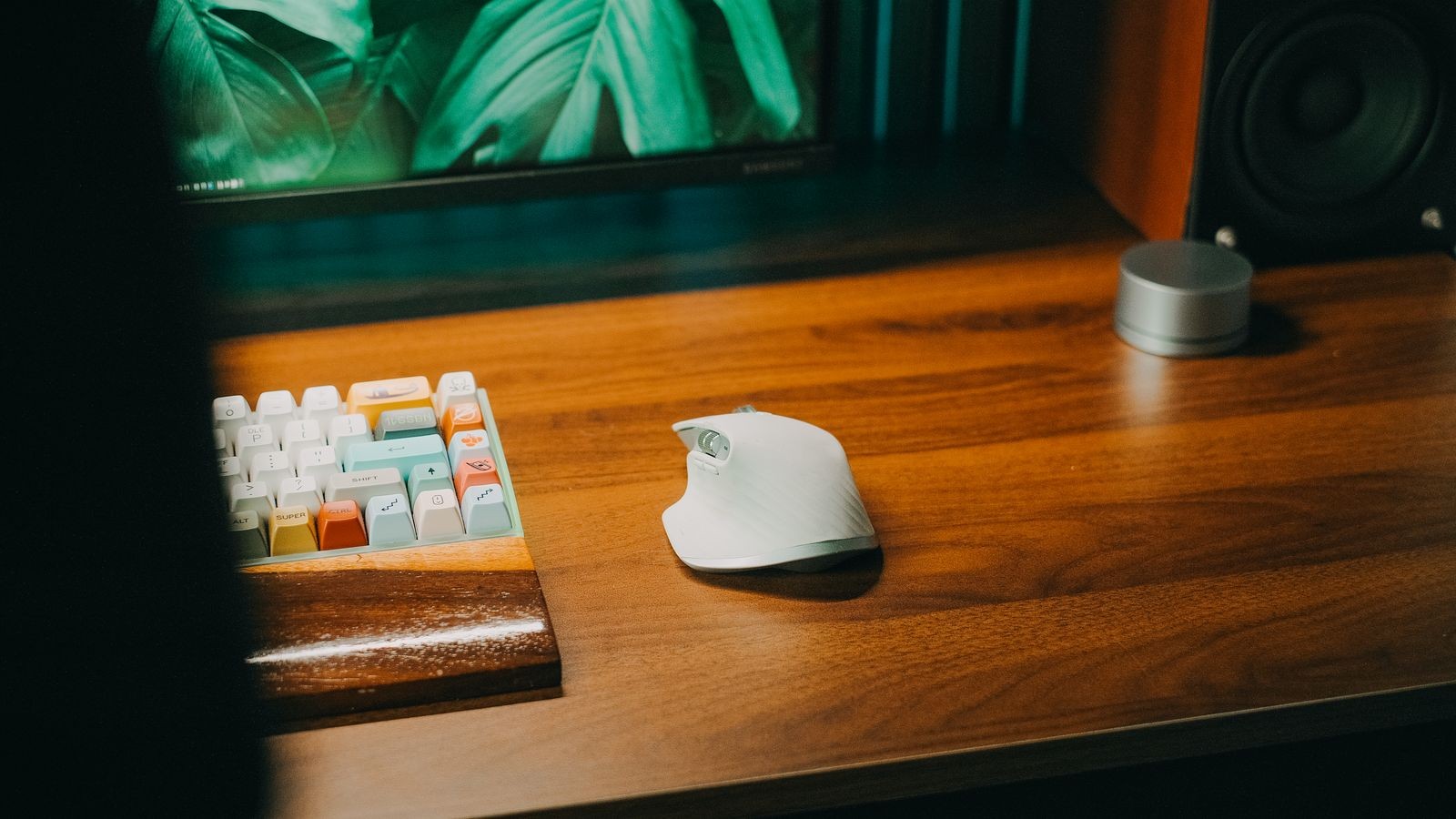 Writer typing on a split ergonomic keyboard at a home office desk