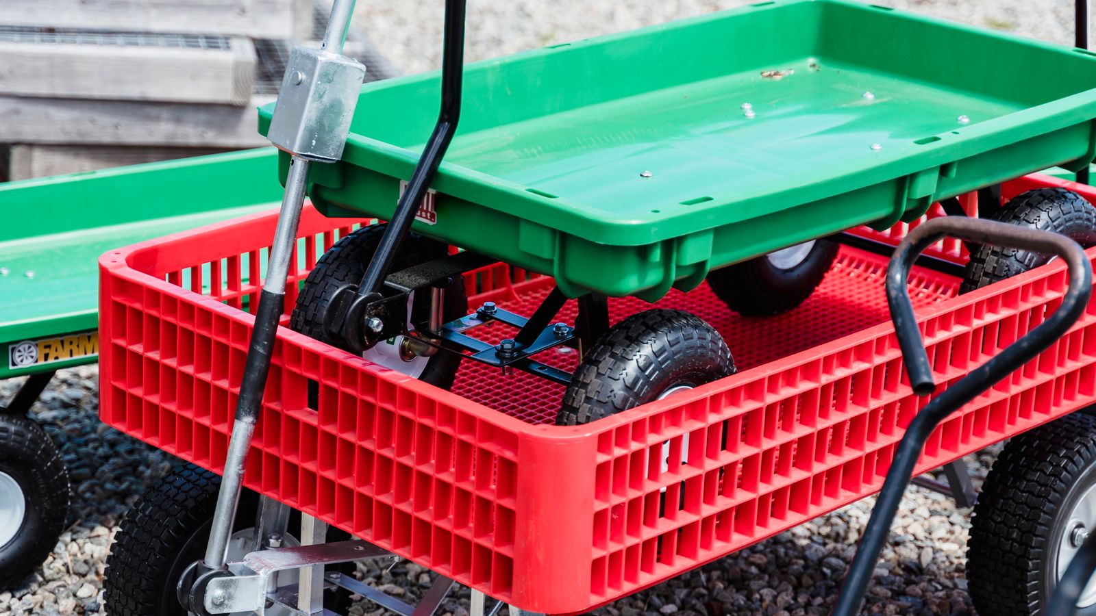 Small rolling utility cart used as extra storage next to a home office desk setup