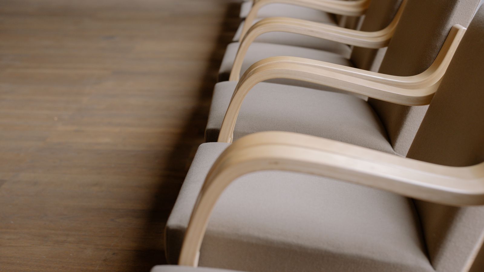 Close-up of a 4D armrest mechanism being adjusted on an ergonomic office chair