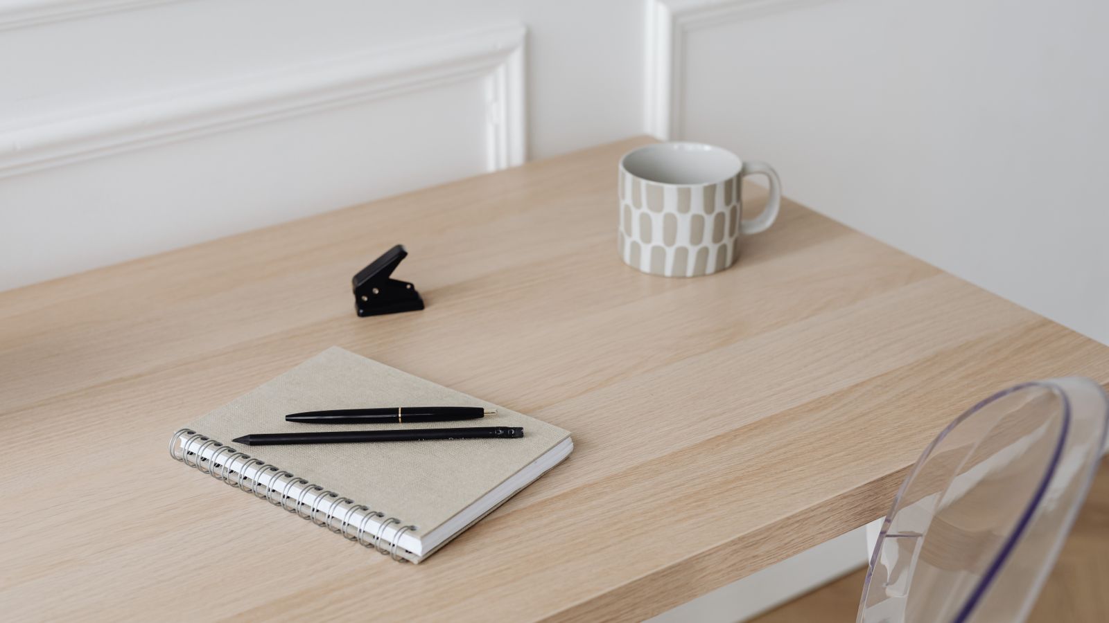 Home office desk with cable management grommet installed in a wood surface