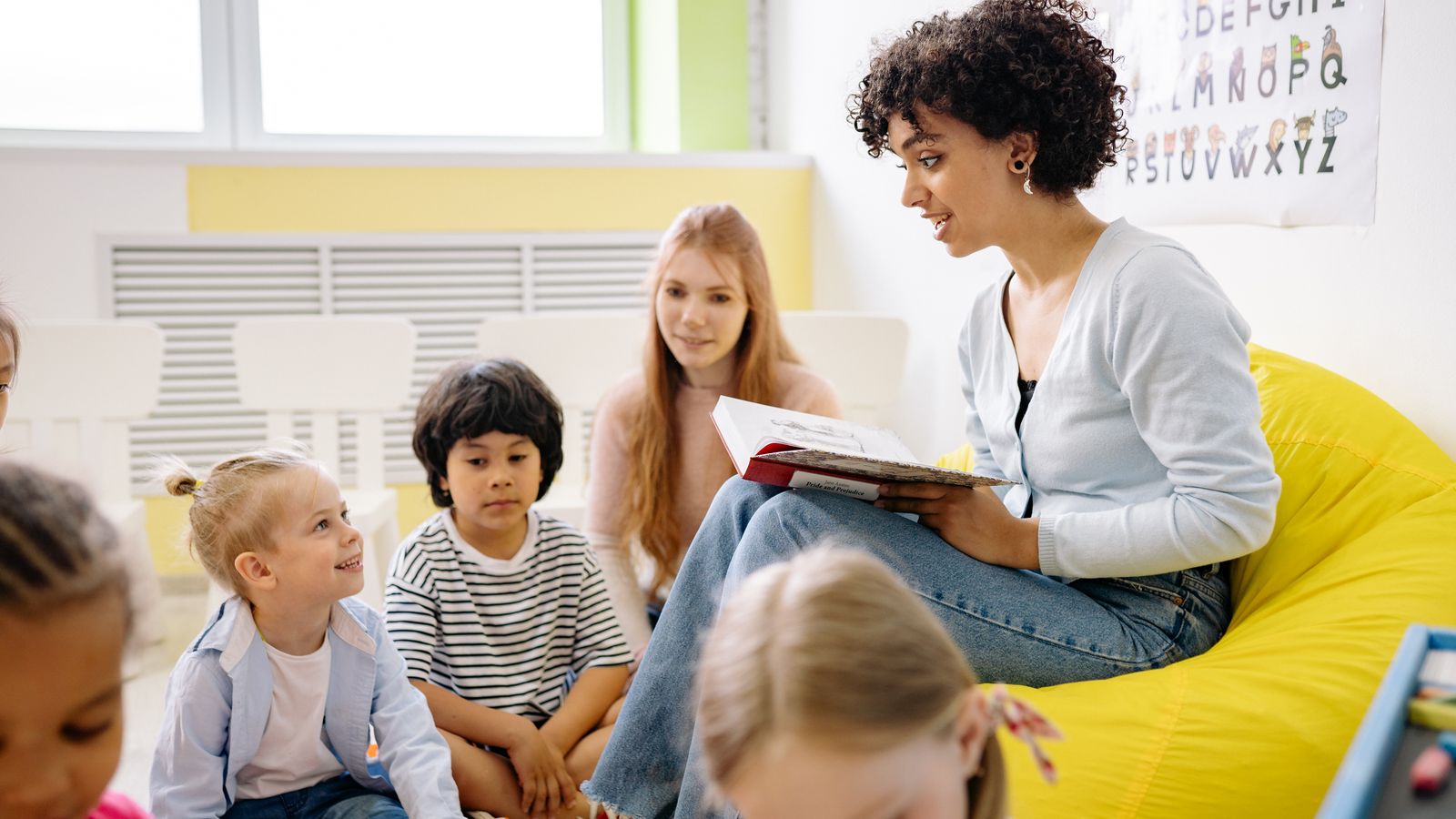 Child sitting in an adjustable kids study chair at a desk