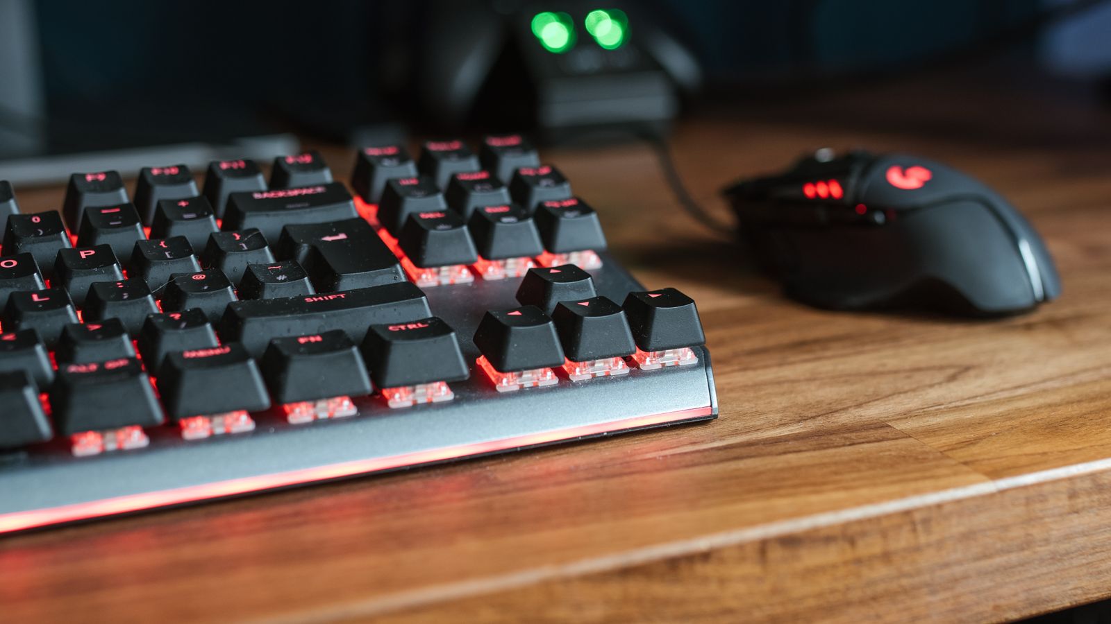 Close-up of a person typing on a curved ergonomic keyboard with visible built-in wrist support