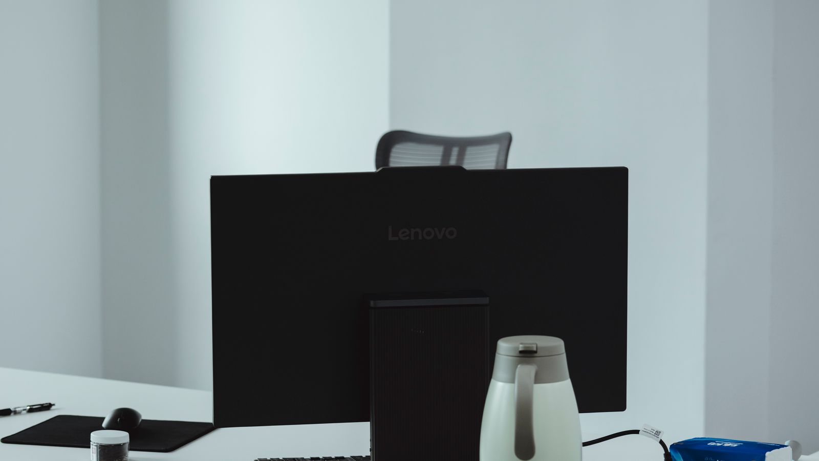Minimalist office desk setup with space cleared for a small heater