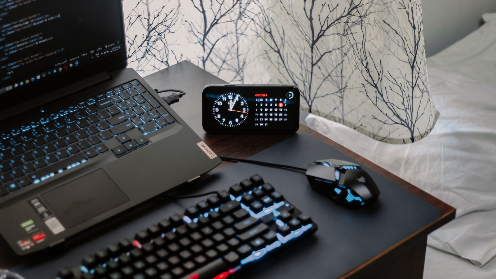 Well organized home desk setup with monitor, lamp, and cable management