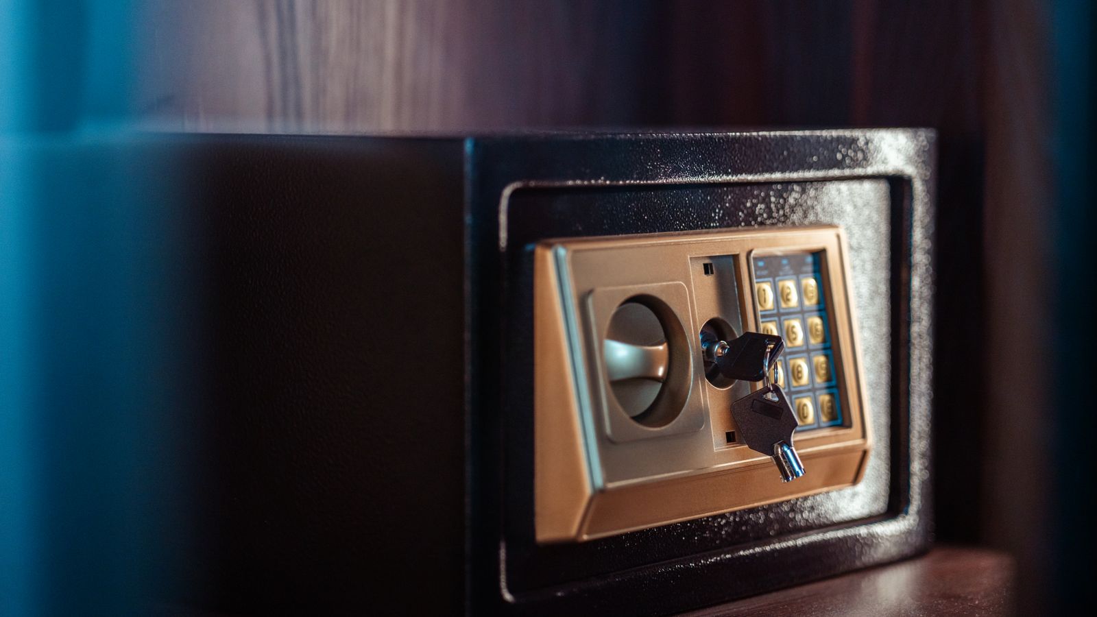 Electronic keypad safe used to store valuables inside a home