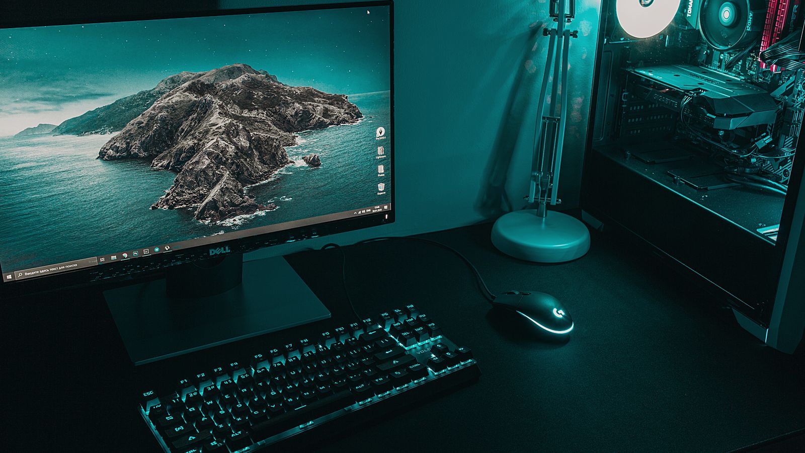 Desktop computer tower resting on a metal stand under an office desk