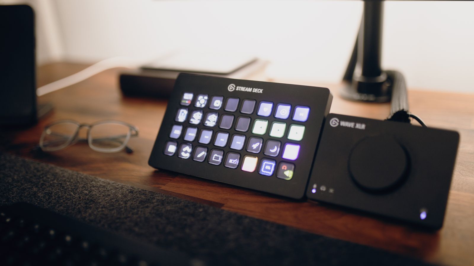 Compact streaming desk setup with monitor and microphone in a small room