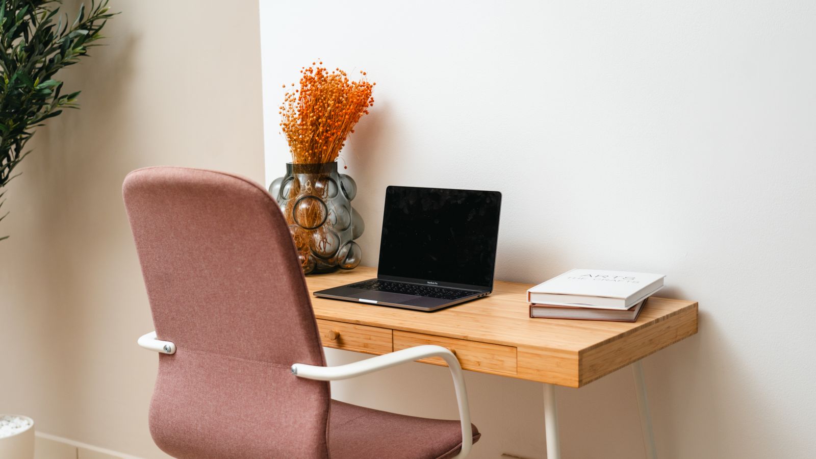 Small home office corner with a compact desk suited for streaming in a tight space