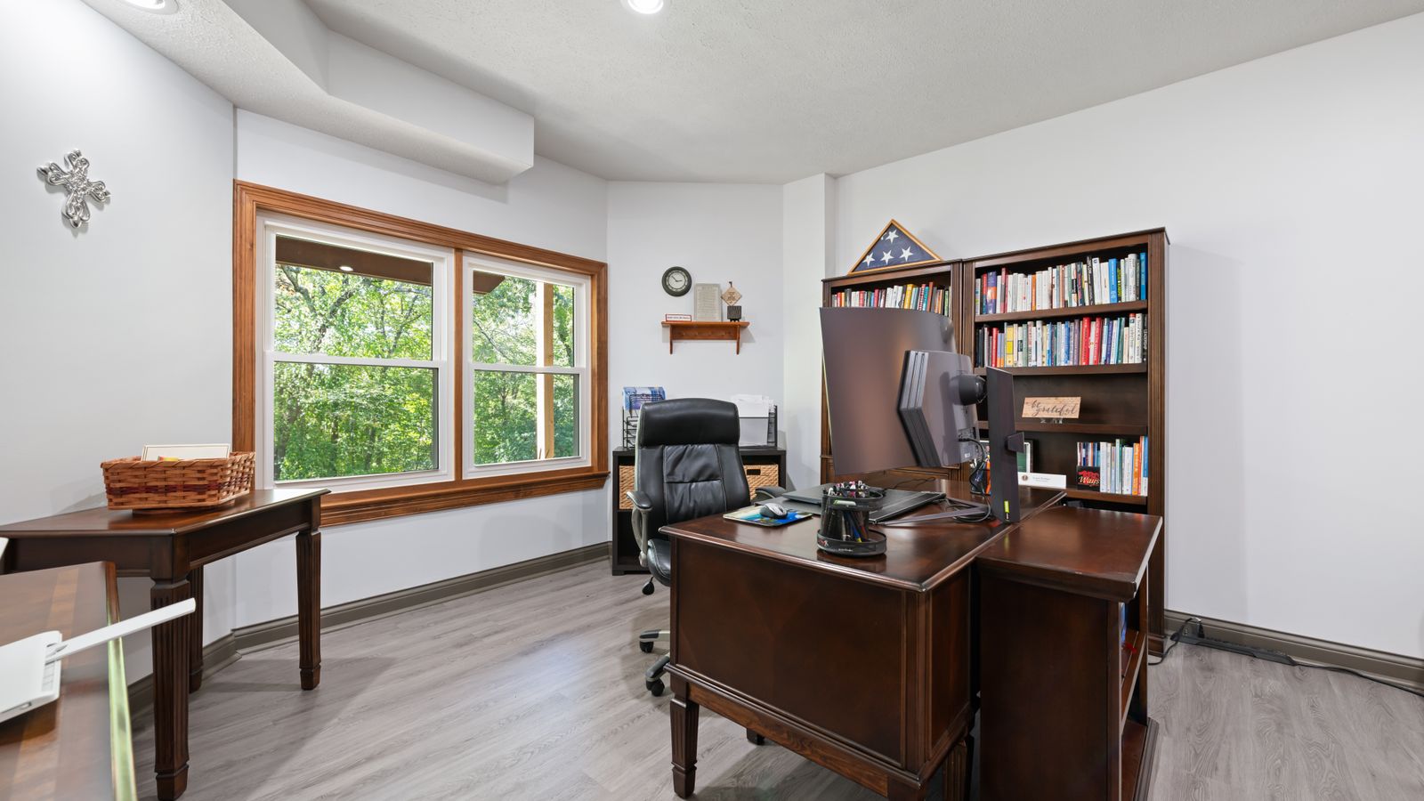 Wooden desk with visible surface in a basement room being checked for moisture damage