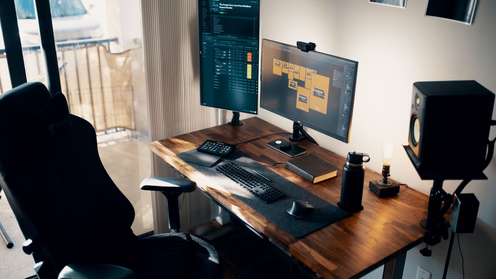 Home office desk setup with dual monitors on a standing desk