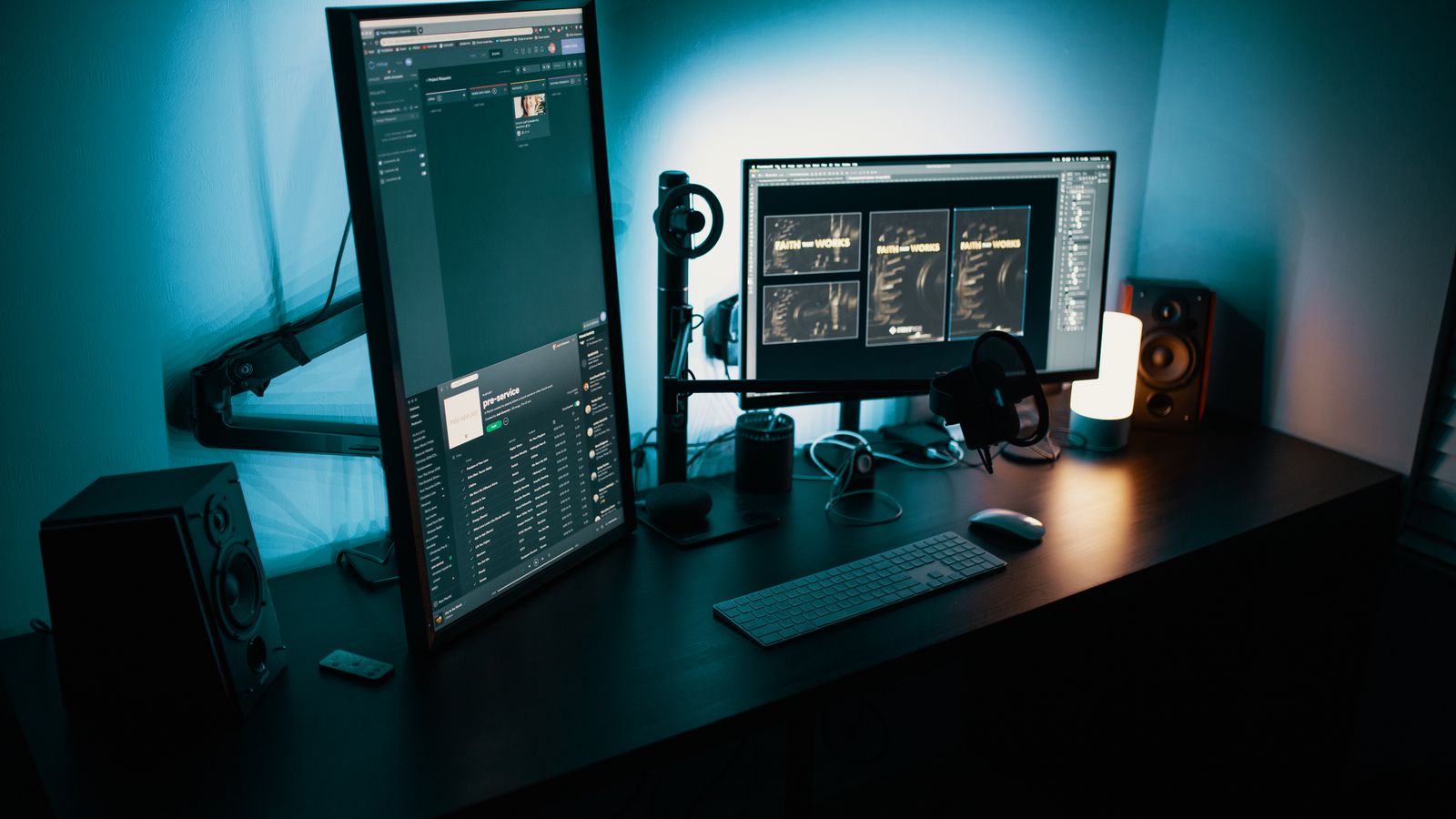Dual monitor arm setup on a wooden desk with organized cable management