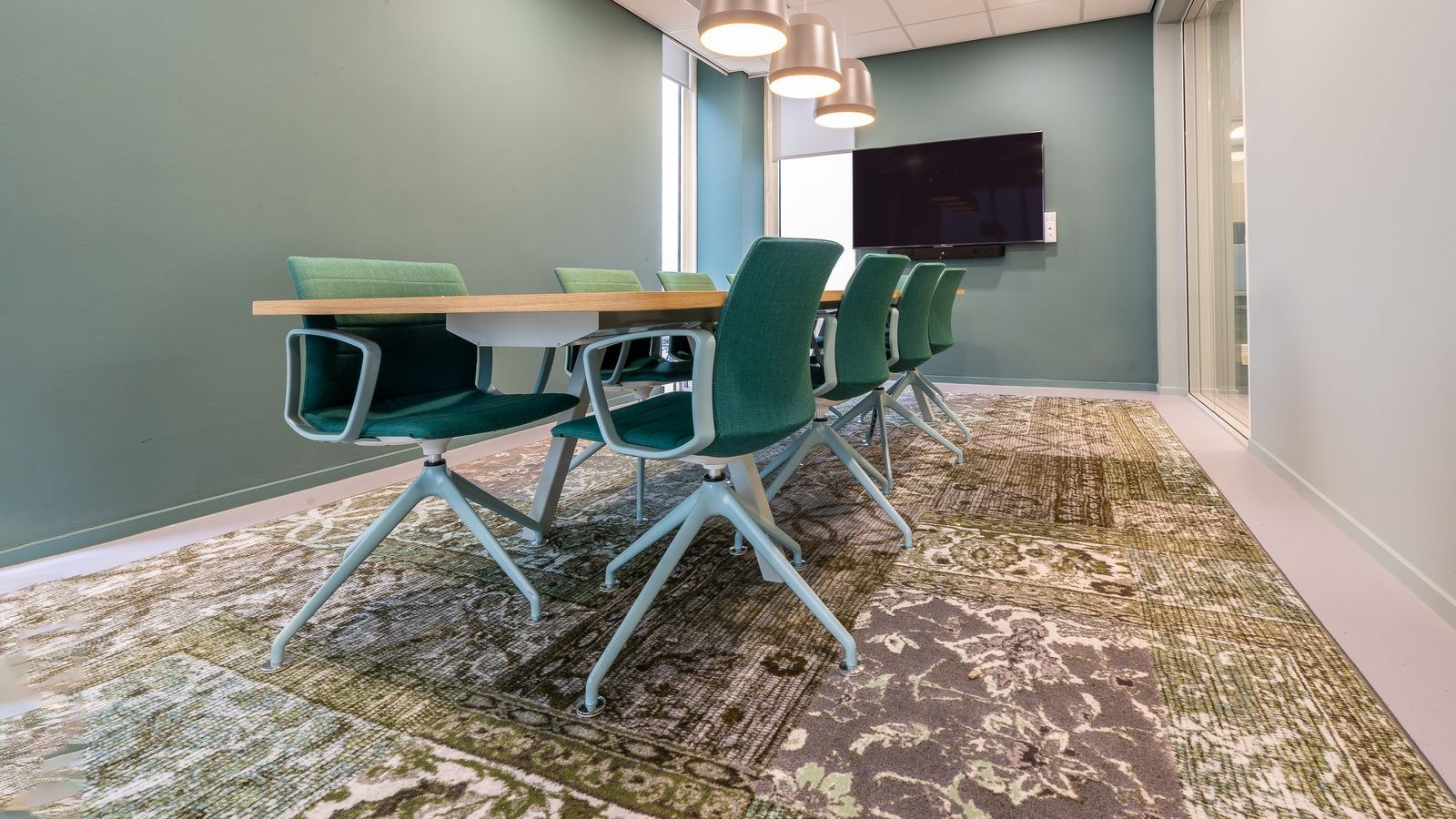 Office chair with large carpet casters positioned on thick plush carpet in a home office