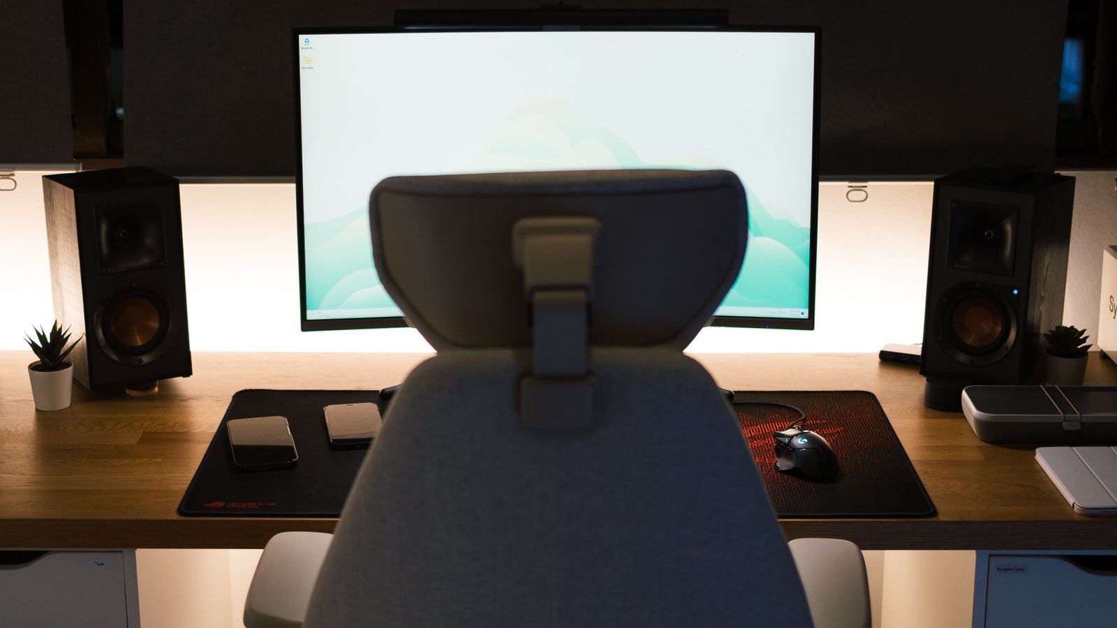 Modern ergonomic office chair set up next to a home office desk