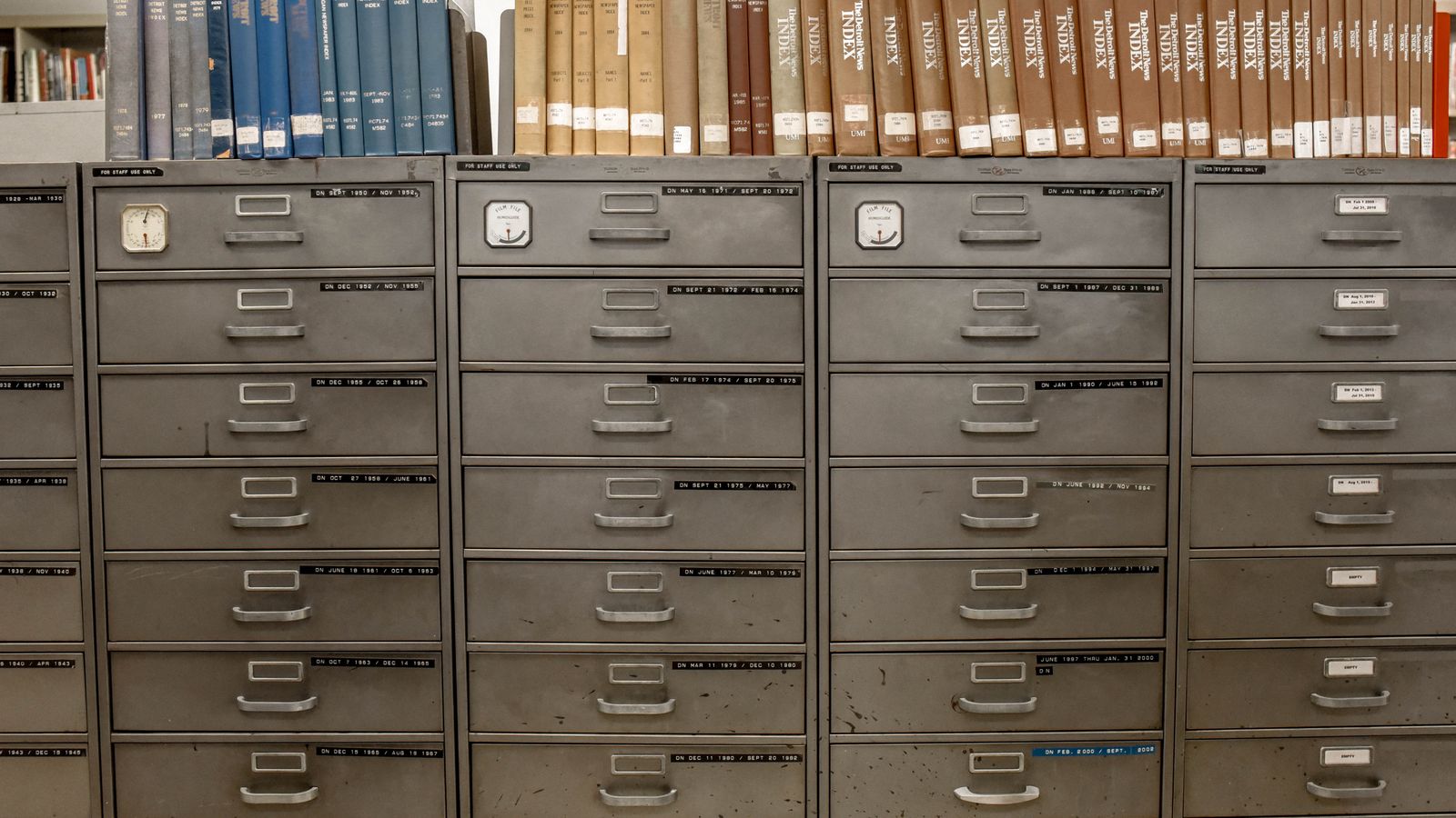 Locking filing cabinet with labeled hanging folders for long-term document storage