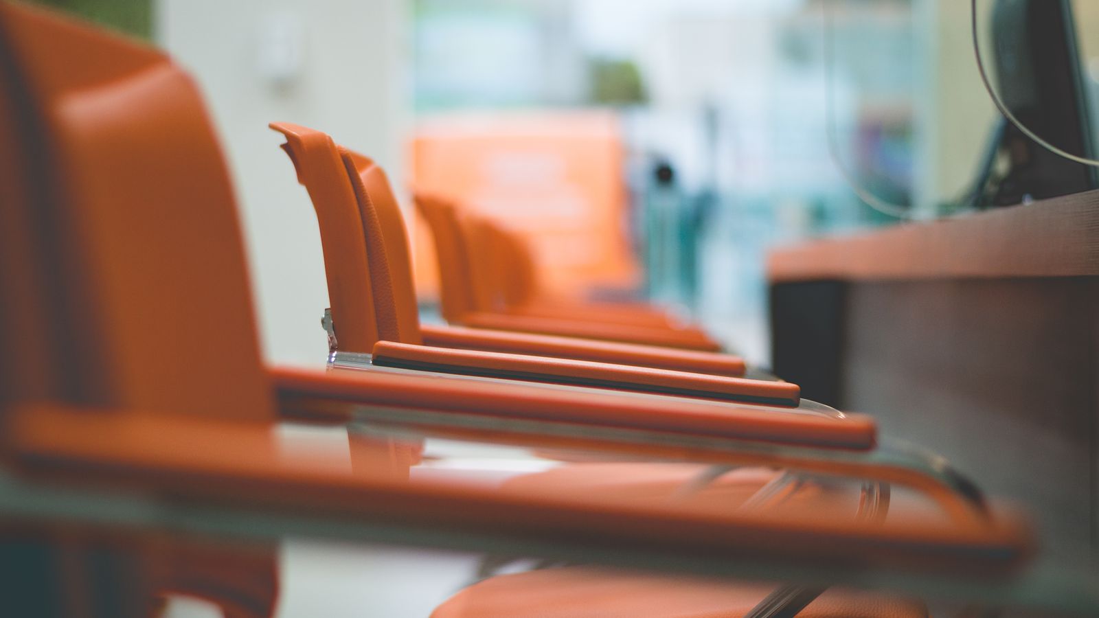 Close-up of a chair seat extender cushion attached to an office chair seat