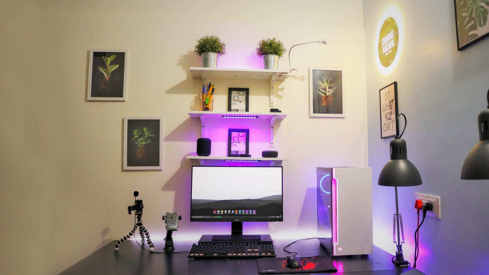 Content creator organizing desk accessories and cables on a leather desk pad