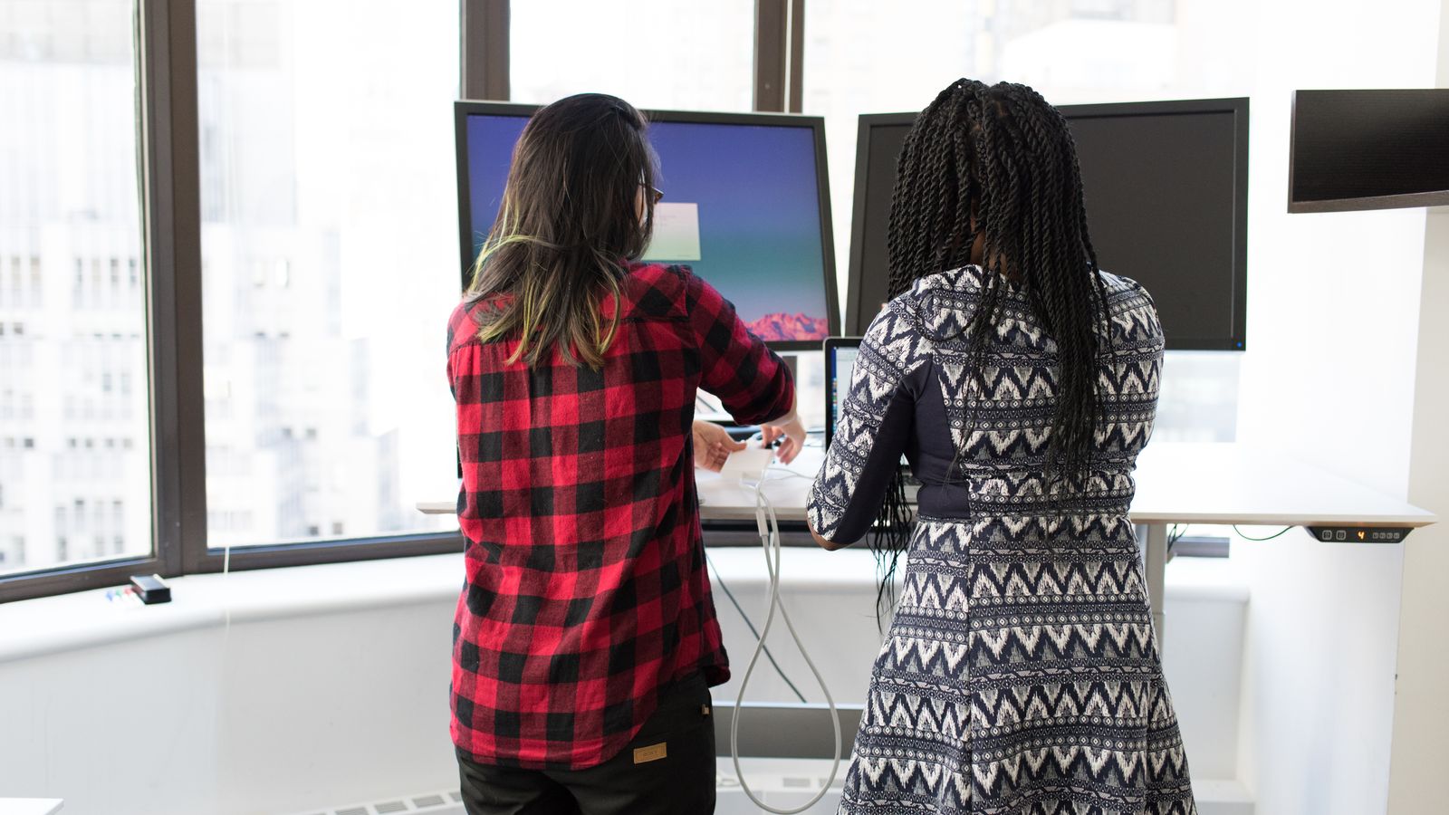 Home office workspace with a standing desk and ergonomic accessories