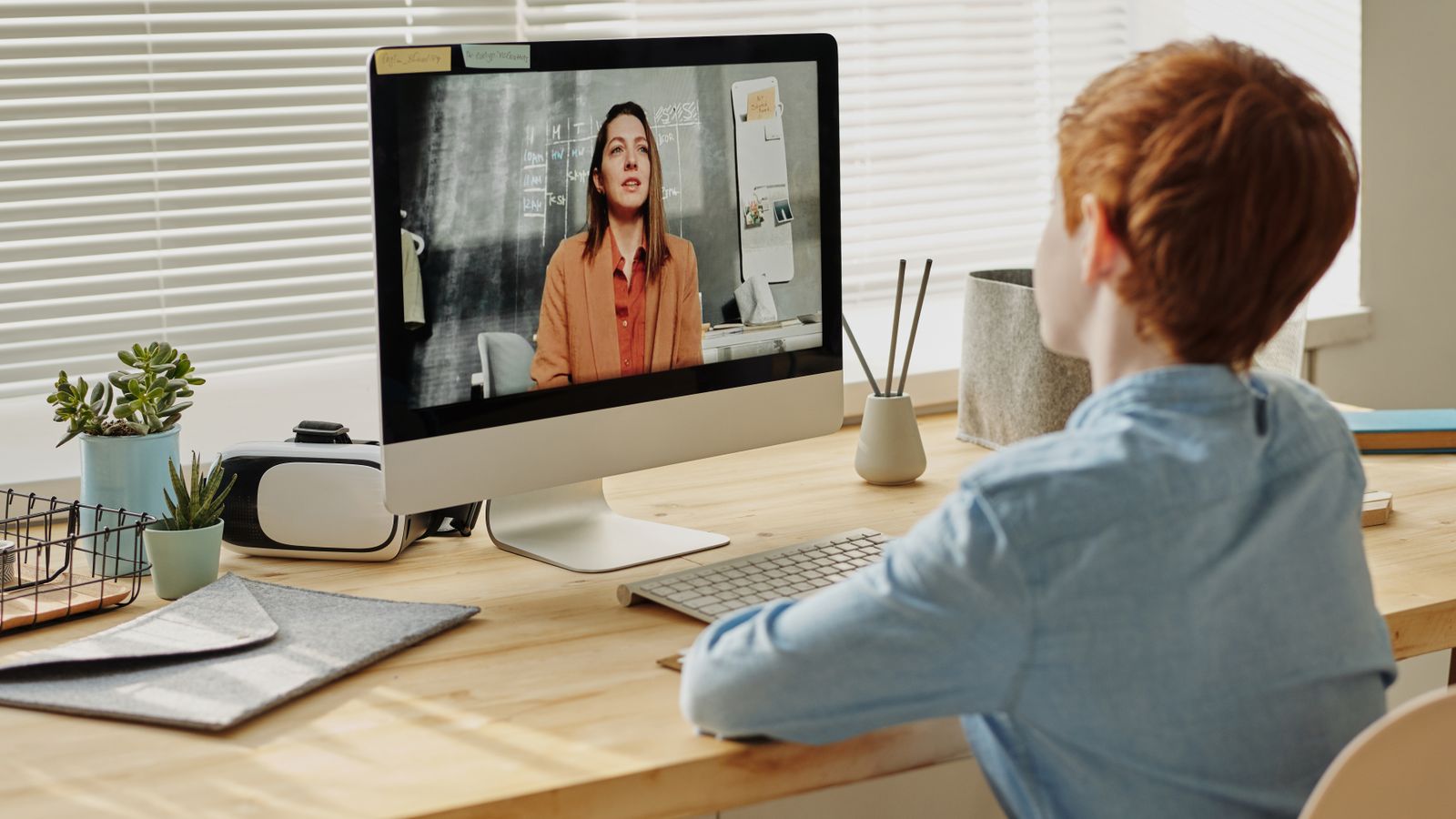Laptop connected to an external monitor and USB-C hub on a home office desk